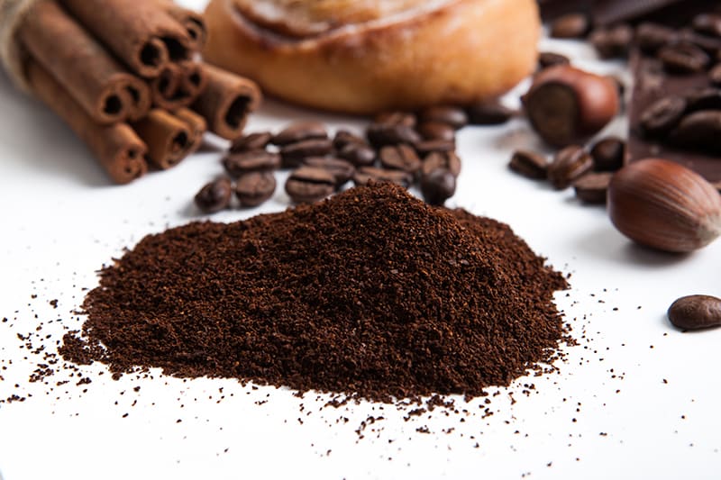 Is it safe to dispose of coffee grounds down the sink?