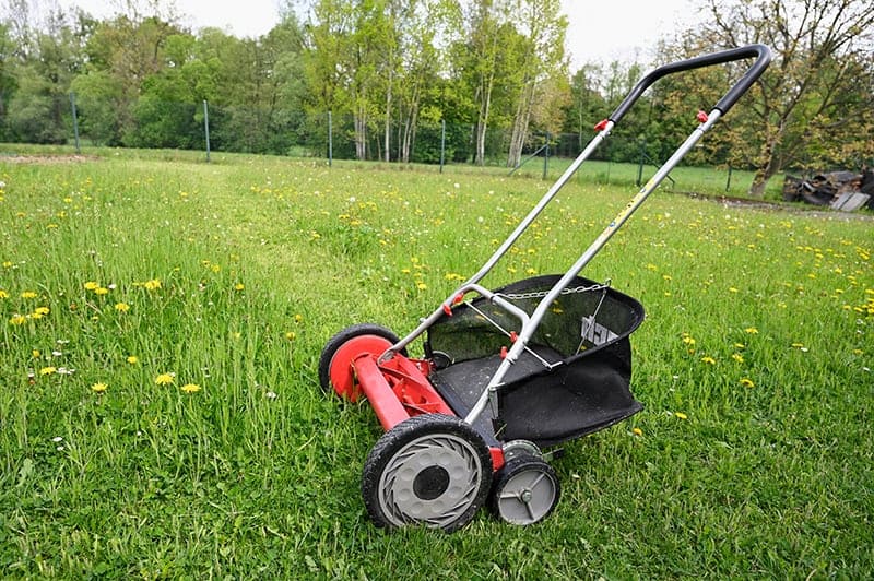 Hand powered clearance lawn mower