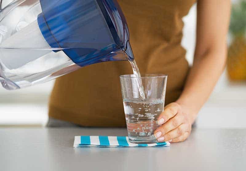 Pouring distilled purified water